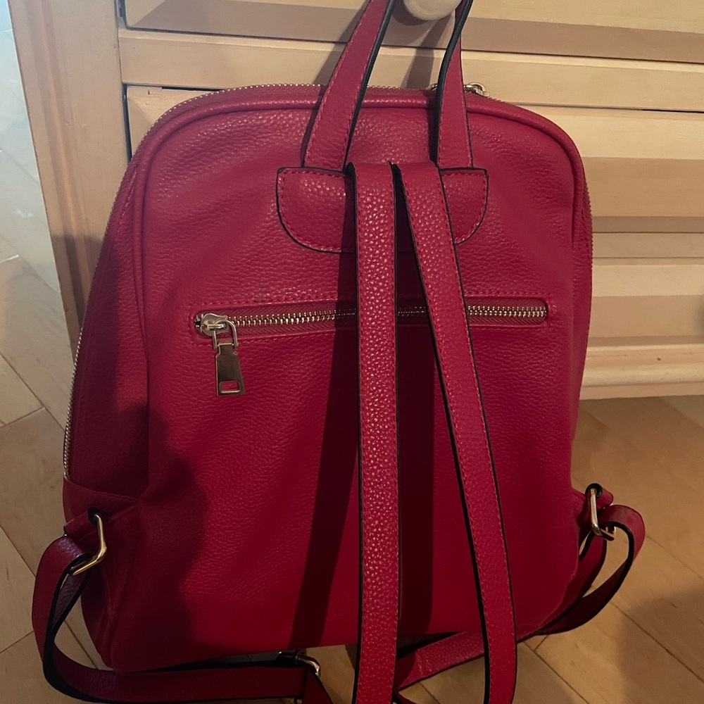 A beautiful red backpack purse. It’s in perfect condition outside and inside.